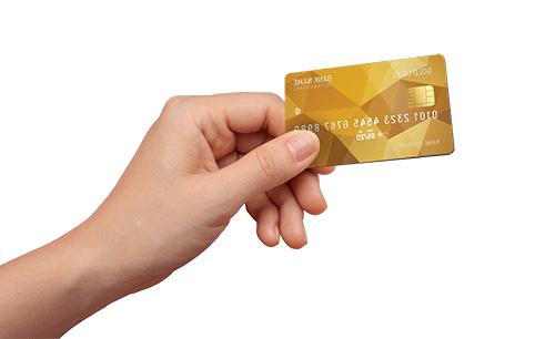 A hand holding up a gold bank card.