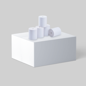 5 new POS rolls on top of a white cube. Four of the rolls are nicely placed on top of the cube with one roll having fallen over.