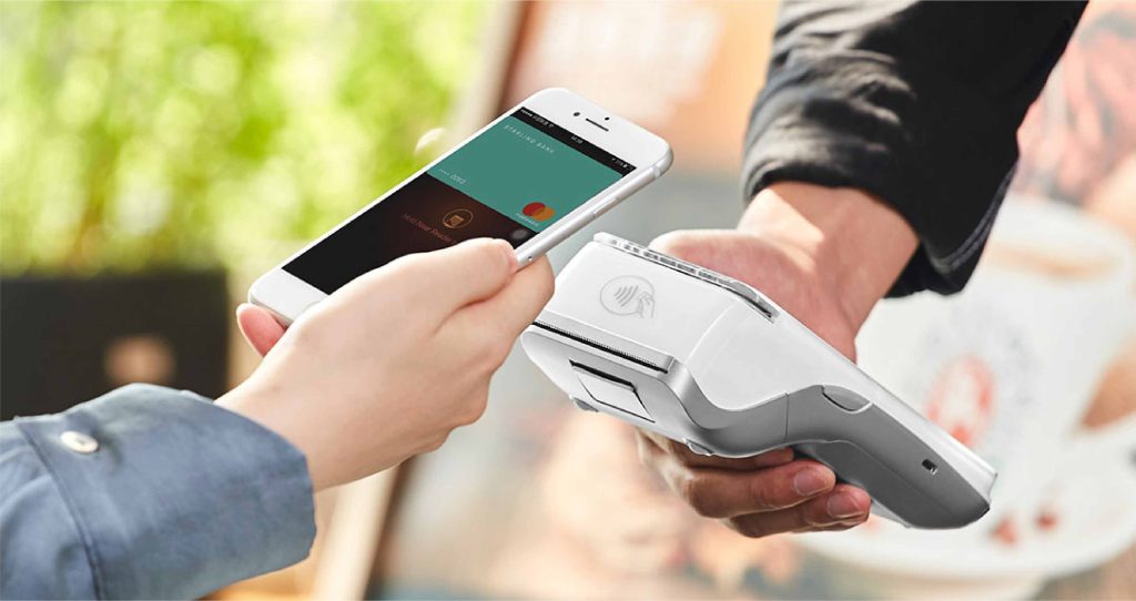a card machine for small business taking a credit card payment
