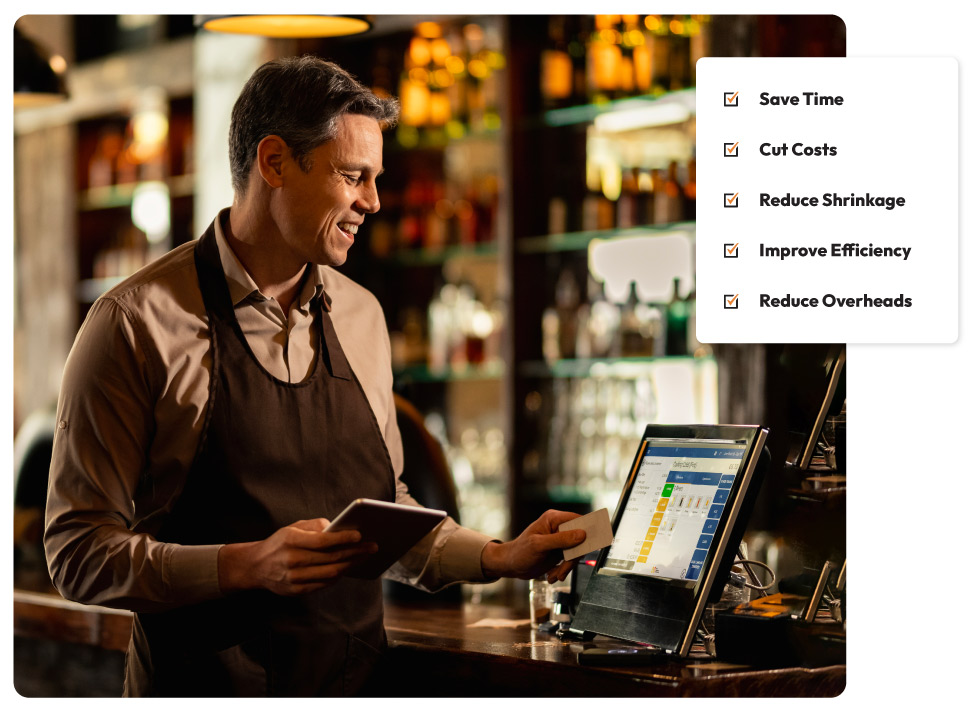 An employee takes a payment at a wired card machine