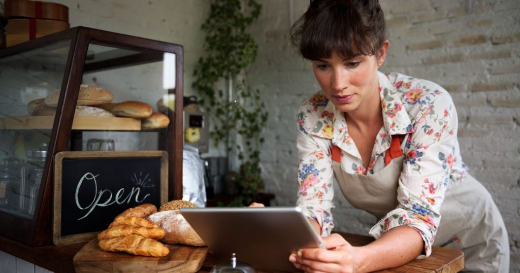 a female business owner looking at small business finance management