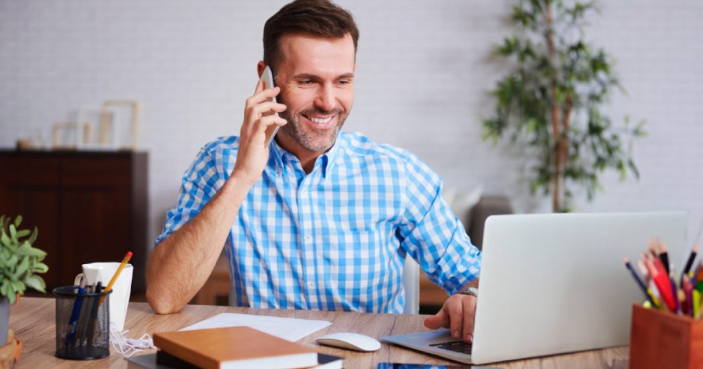 a man uses a virtual terminal for processing credit cards to take a payment