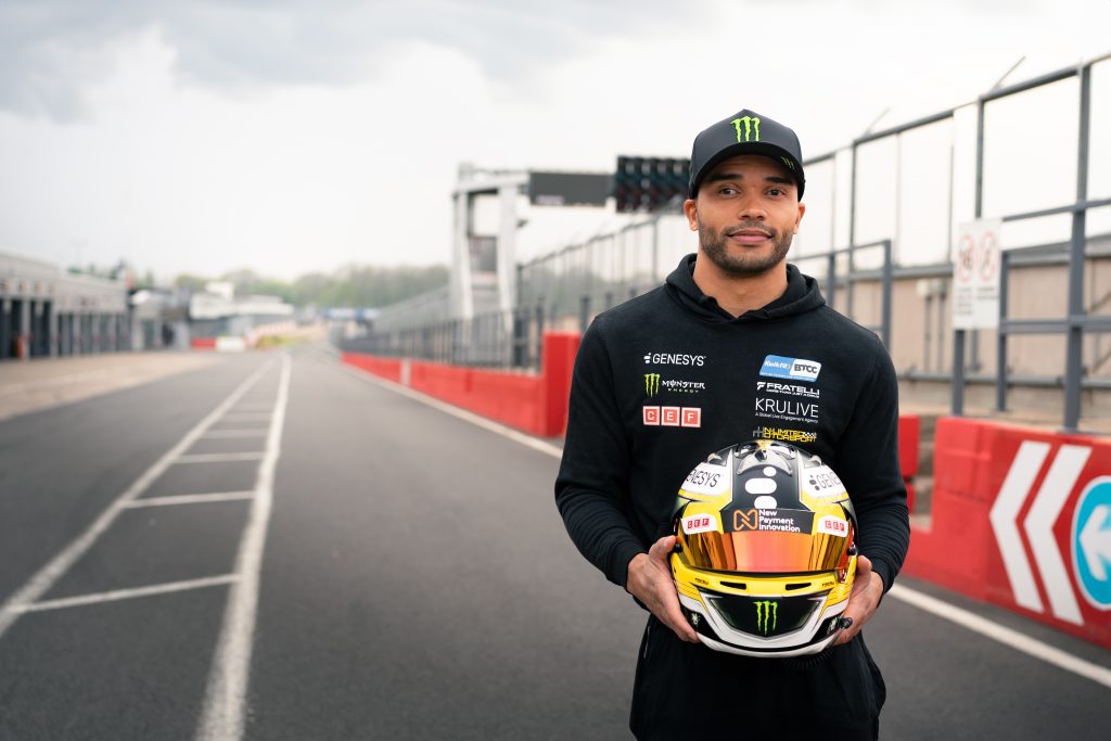 Nicolas Hamilton BTCC driver holding racing helmet with New Payment Innovation sponsorship logo at 2025 championship announcement