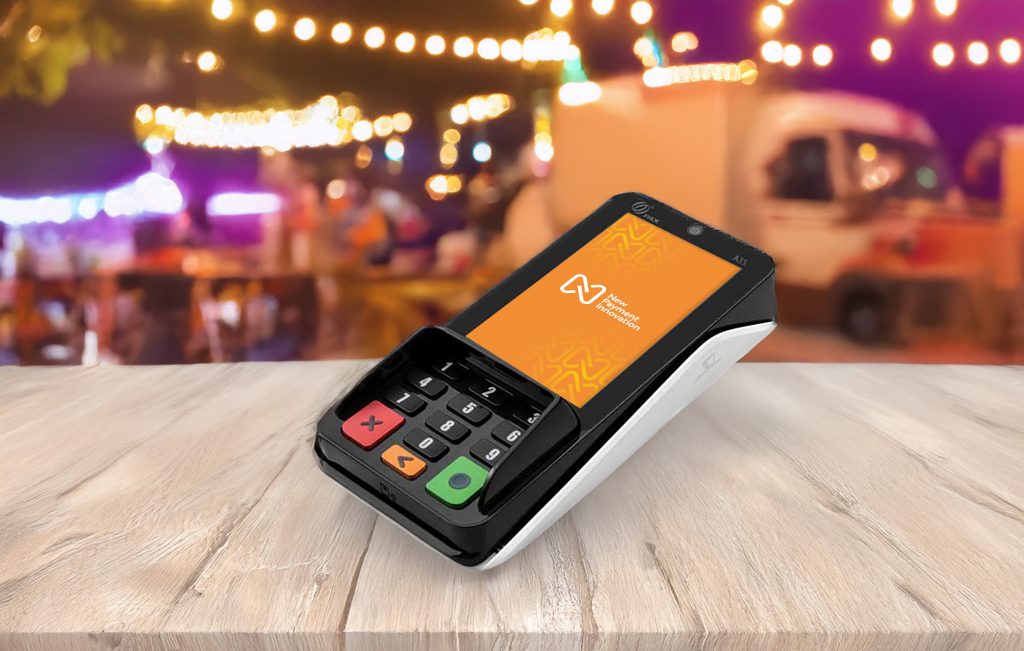 Card reader for market stalls Ireland: vendor using New Payment Innovation terminal at Dublin food market processing contactless payment