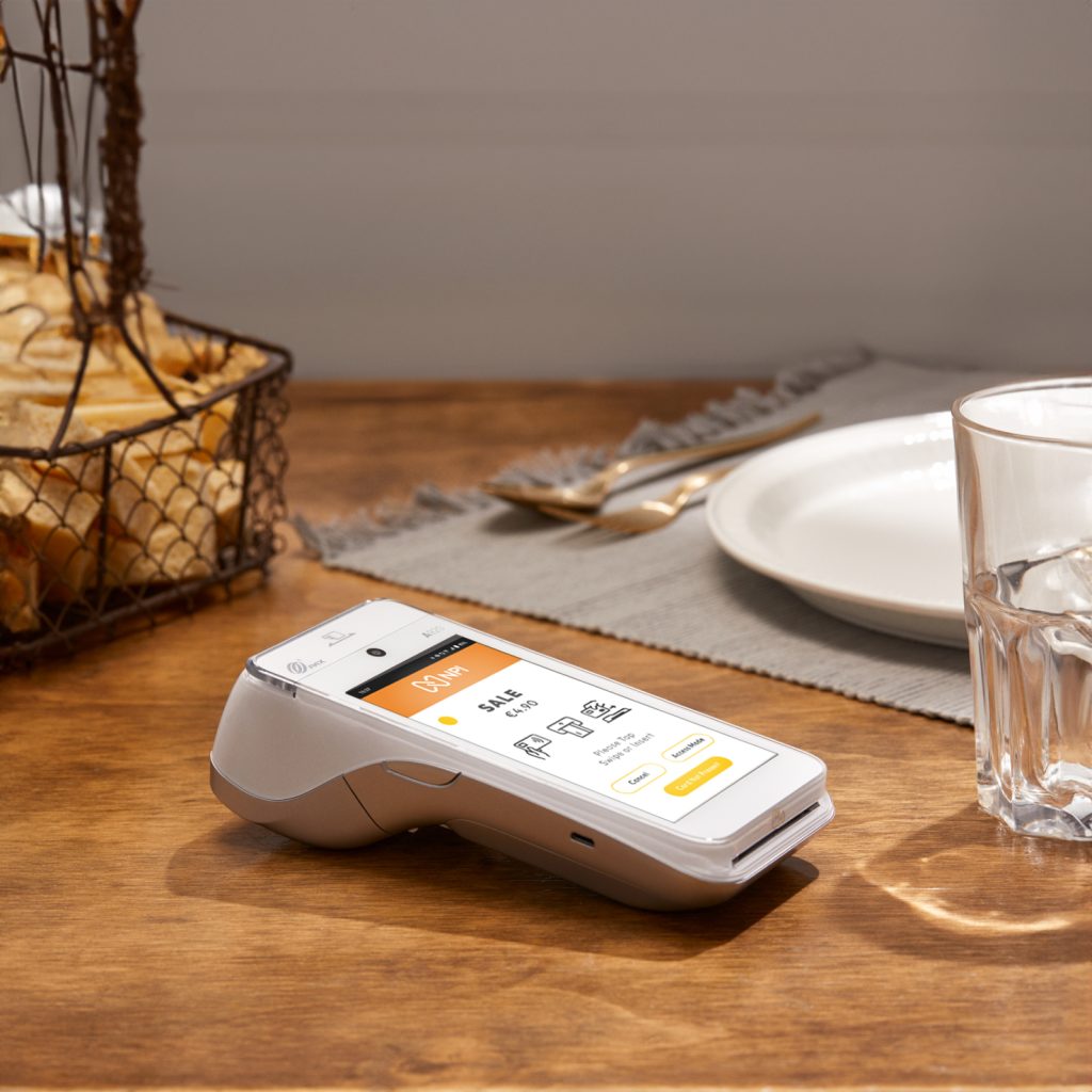 Card machine with lowest fees Ireland PAX A920 PRO on restaurant table for efficient payment processing