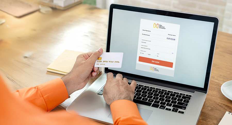 Payment gateway integration Ireland person making online payment on laptop using New Payment Innovation powered gateway