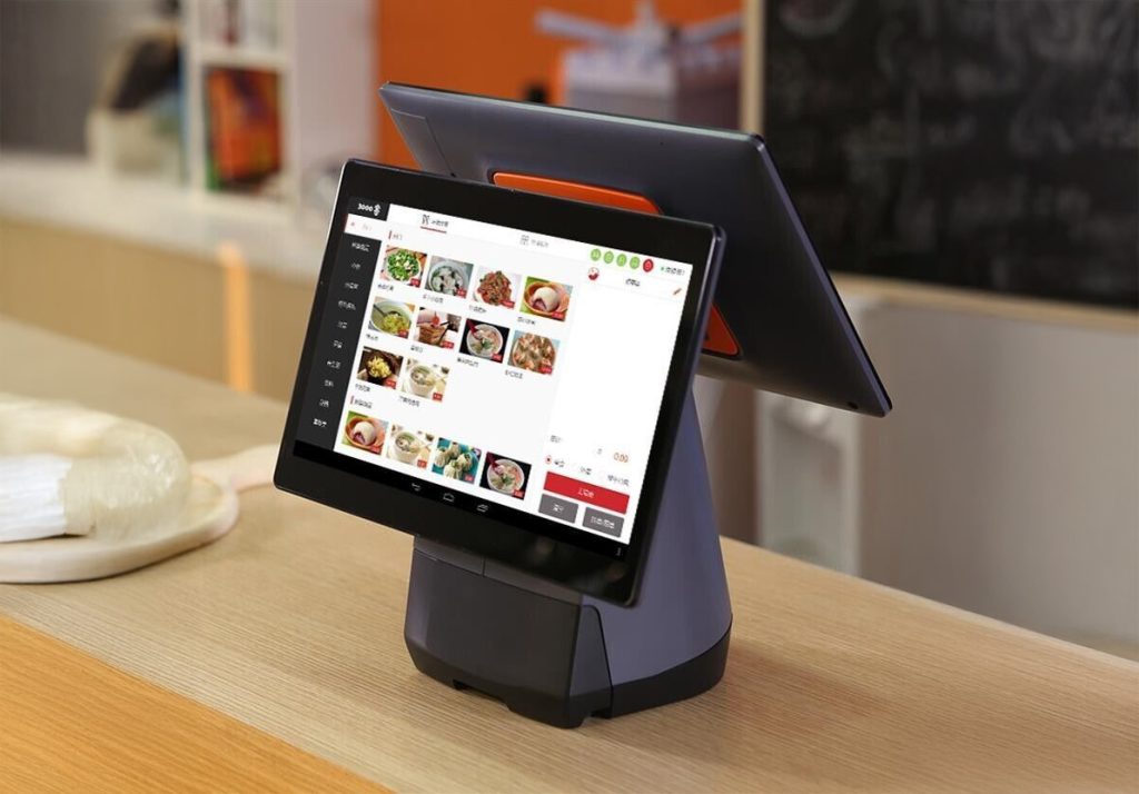 SUNMI T2S double screen EPOS system with integrated printer on coffee shop counter displaying transaction interface