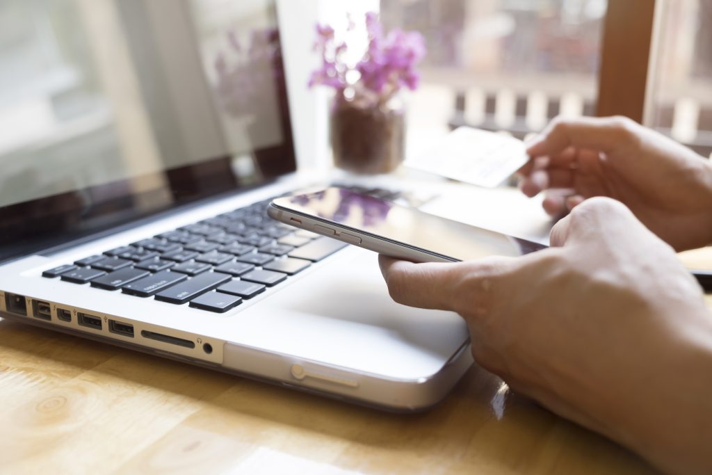 person making secure payment on laptop demonstrating secure online payments Ireland with PCI compliance Ireland and payment security Ireland features
