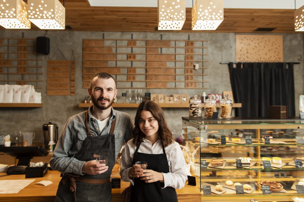 Small business ideas in Ireland coffee shop with two baristas serving customers