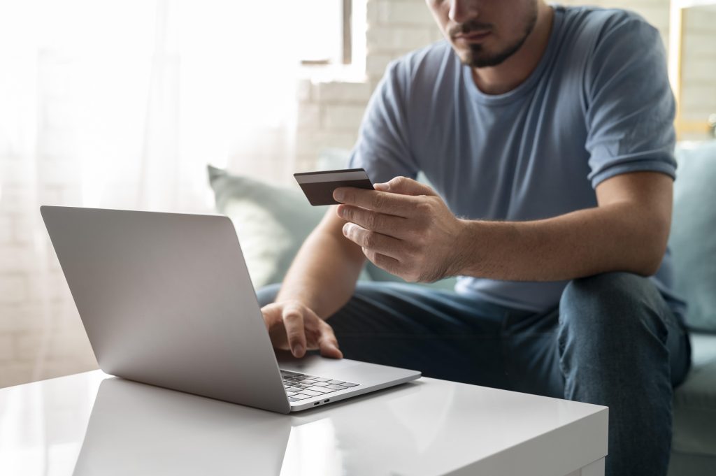Customer using strong SCA requirements Ireland for secure online payment on laptop in Ireland