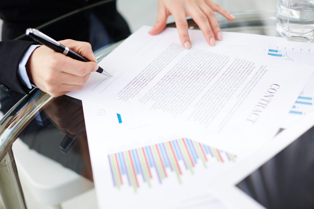 Irish business owner signing payment contract Ireland agreement with merchant services provider