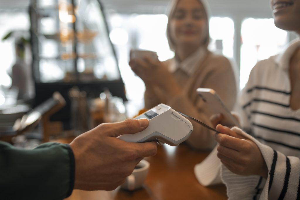 Customer making contactless payment using PAX A920 PRO terminal for online payments Ireland business