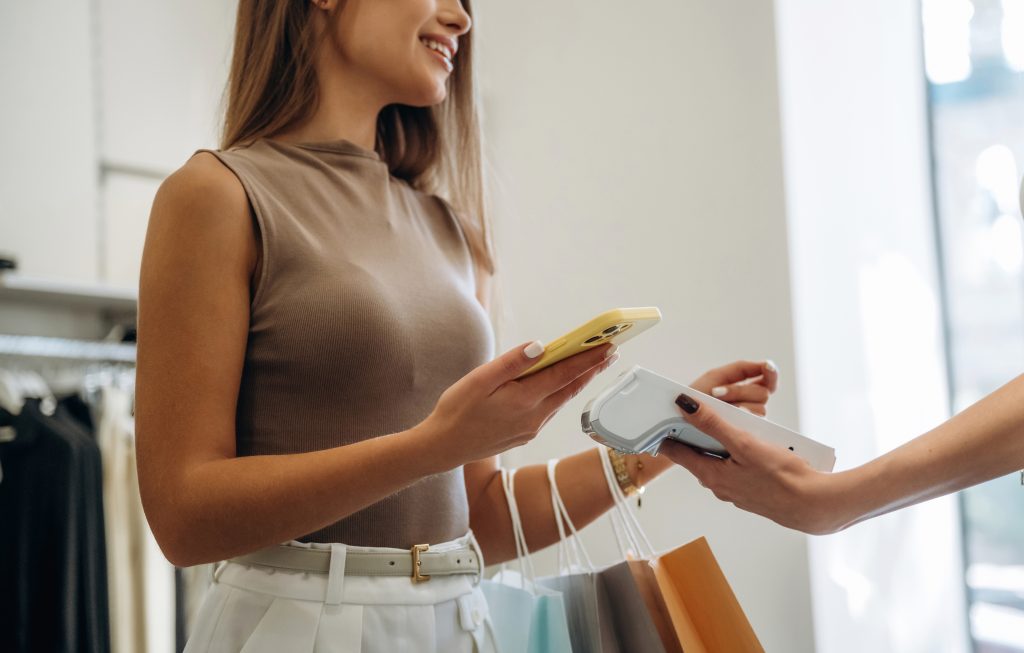 Retail payment systems Ireland contactless payment at clothing store checkout