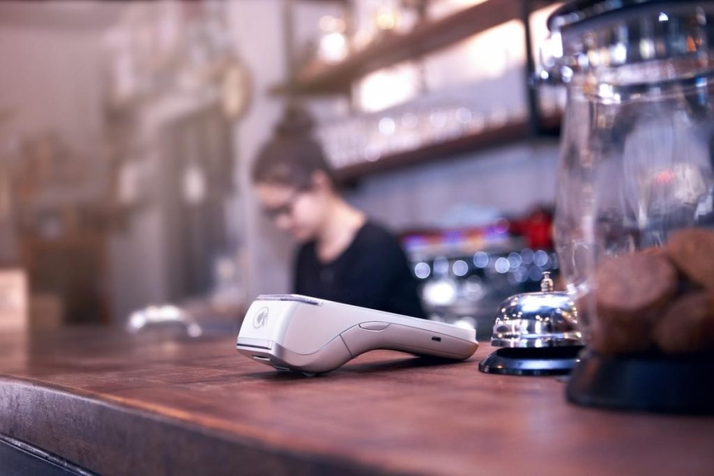 NPI vs Elavon. PAX A920 Pro card machine on a coffee shop counter in Ireland